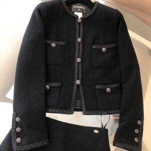CHANEL Iconic La Petite Veste Noire Wool Black Two Piece Set - Jacket and skirt.
